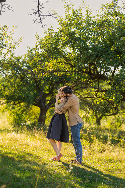 man hugging his girlfriend in nature - Valokuva, kuva