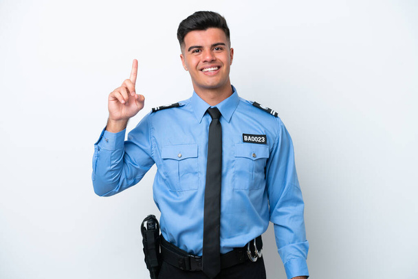 白地に隔離された若い警察の白人男性最高の兆候で指を見せて持ち上げる - 写真・画像