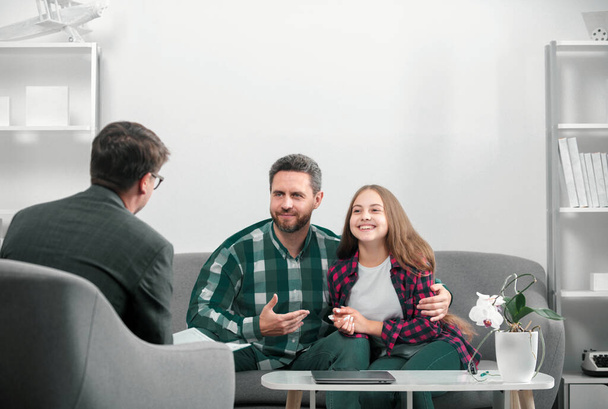 Psychology, mental family therapy, psychologist with father and daughter at psychotherapy session on psychological consultation. Parents telling the psychologist about family or child problems - Zdjęcie, obraz