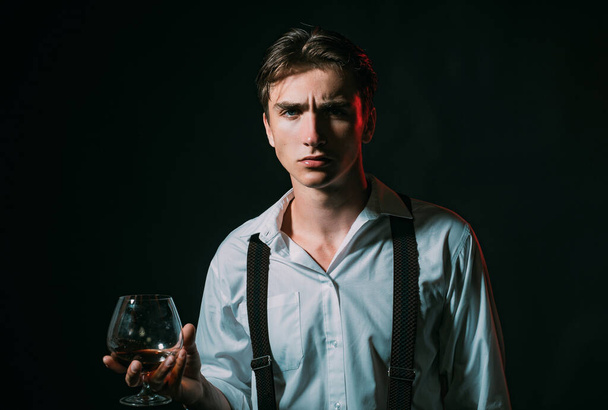 Tasting and degustation concept. Man with glass of whiskey - 写真・画像