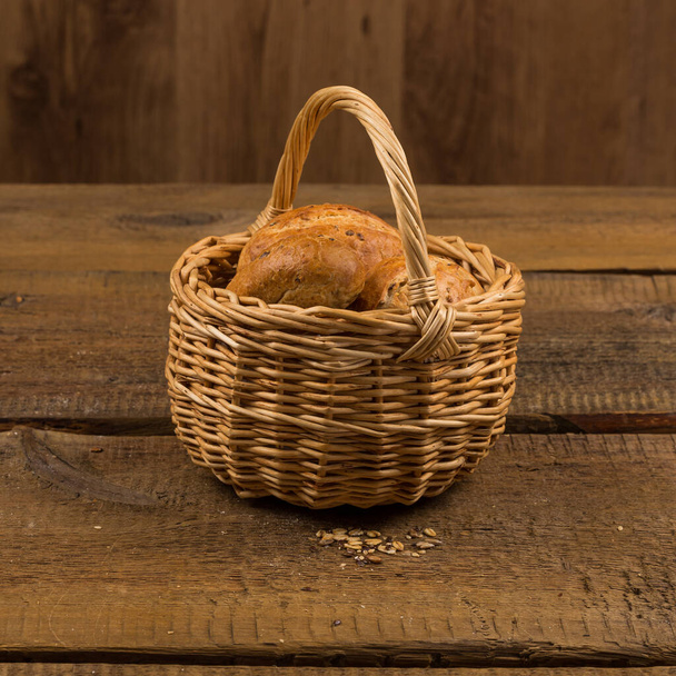 assortment of bread, baking products on wooden table - Φωτογραφία, εικόνα