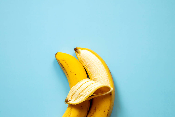 LGBT love concept, close-up, two bananas lie side by side, a symbol of male love. - Foto, Imagem