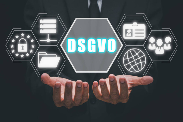DSGVO Datenschutzgrundverordnung Konzept, Person hält DSGVO-Symbol auf virtuellem Bildschirm in der Hand. - Foto, Bild