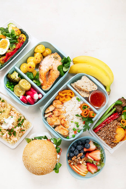 Healthy meal slimming diet plan daily ready menu background, organic fresh dishes and smoothie, fork knife on paper eco bag as food delivery courier service at home in office concept, top view. Copy space. - Photo, Image