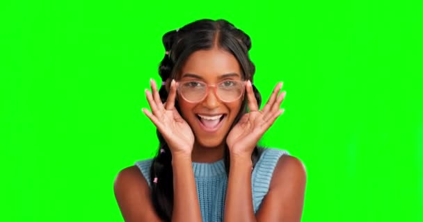 Glasses, face and woman in a studio with green screen for optical awareness, health or wellness. Happy, smile and portrait of an Indian female model posing with spectacles by a chroma key background - Filmmaterial, Video