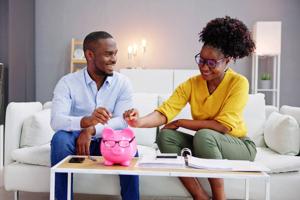 Happy African Couple Doing Retire Finances Plan And Money Budget - Foto, Imagen
