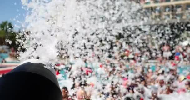 Foam cannon against sky and pool at foam party. Entertainment for tourists - Footage, Video