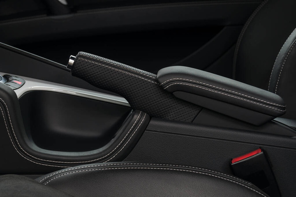 Hand brake in car. Auto interior detail. Leather and stitch. - Photo, Image