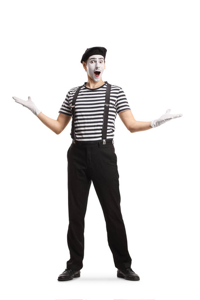 Full length portrait of a mime gesturing welcome isolated on white background - Фото, зображення
