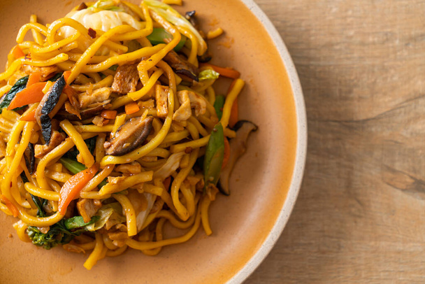 stir-fried yakisoba noodles with vegetable in vegan style - Vegan and vegetarian food style - Photo, image