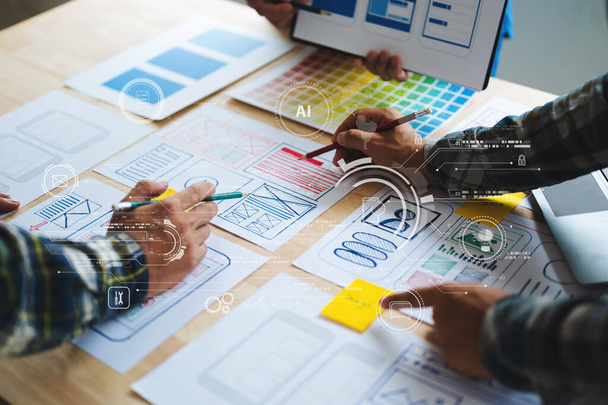  UX developer and ui designer brainstorming about mobile app interface wireframe design with customer brief and color code at modern office - 写真・画像
