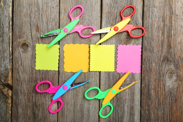 Colored figured scissors with papers - Фото, зображення