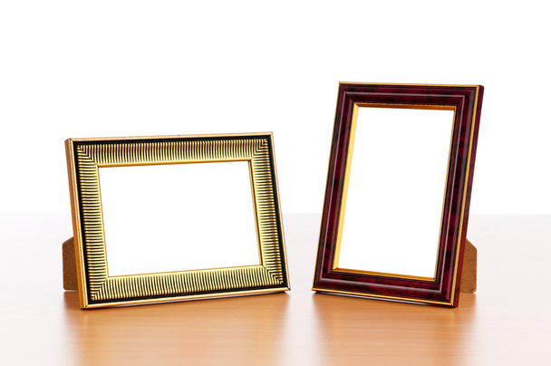 Photo frames on the table - Φωτογραφία, εικόνα