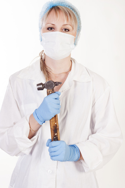 Young doctor with hammer - Foto, afbeelding