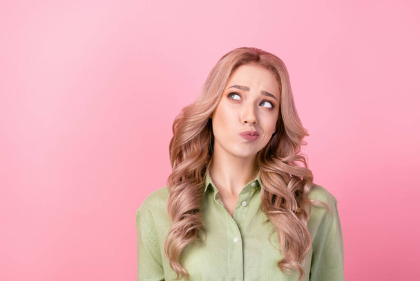 Photo of creative lady look empty space contemplate hesitate isolated on pink color background. - Фото, изображение