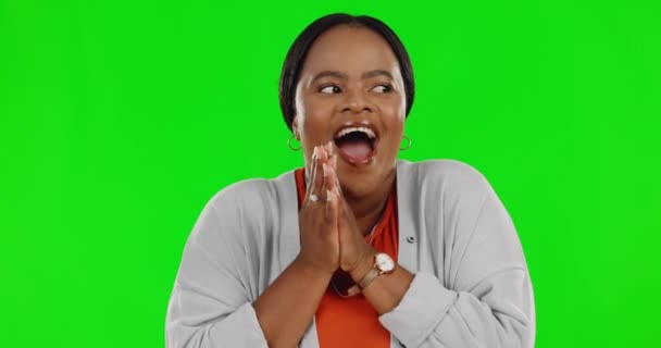 Black woman, surprise and celebration in applause on green screen for winning against a studio background. Portrait of happy, excited or surprised African female clapping for win or success on mockup. - Felvétel, videó