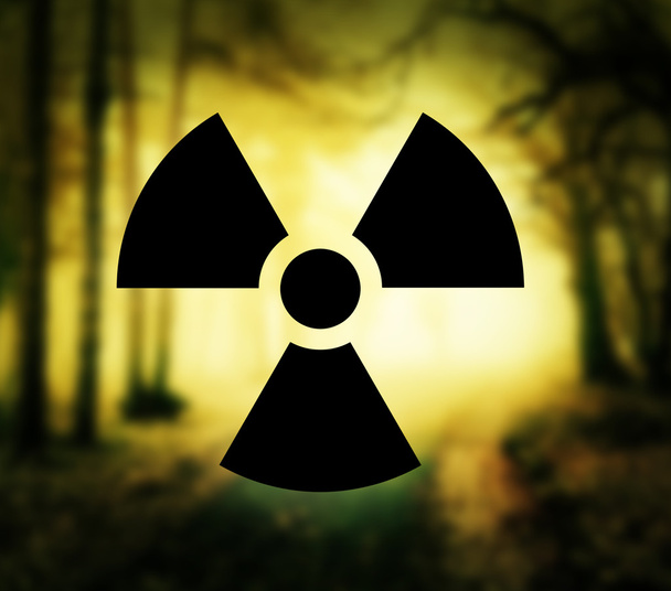 Simbolo di radioattività con foresta incandescente
 - Foto, immagini