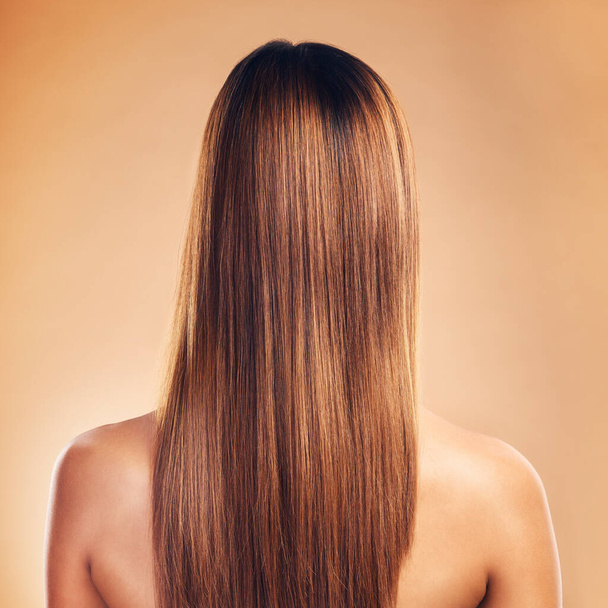Woman, hair and beauty with hairstyle and back view, haircare and keratin treatment isolated on studio background. Female model with highlights, color and cosmetic care, texture and growth with shine. - Foto, imagen