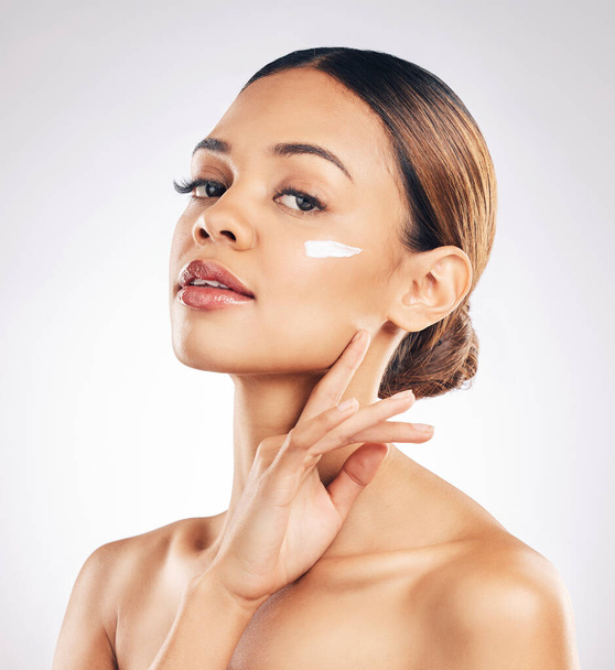 Skincare, portrait and woman with face cream in studio for cosmetic, wellness or hydration on grey background. Facial, beauty and female model relax with sunscreen, moisturizer or collagen mask. - Valokuva, kuva
