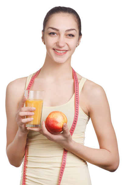 Beautiful girl with juice and apple - Фото, изображение