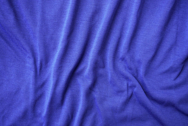 Синій шовковий фон тканини, синя текстура спортивного одягу - Фото, зображення