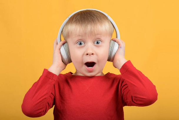 boy child enjoys music in headphones - Photo, image
