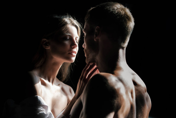 Couple in love face to face, tender hugging and kissing. Beautiful woman and handsome man boyfriend - 写真・画像