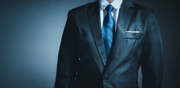 businessman standing on dark gradient background. business concept. suit. - Fotoğraf, Görsel