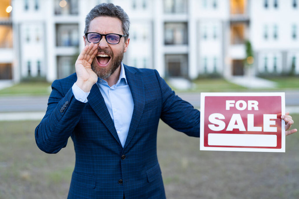 sale property by realtor shout outdoor. photo of realtor with for sale board. sale property by realtor. man realtor hold board for sale property. - 写真・画像