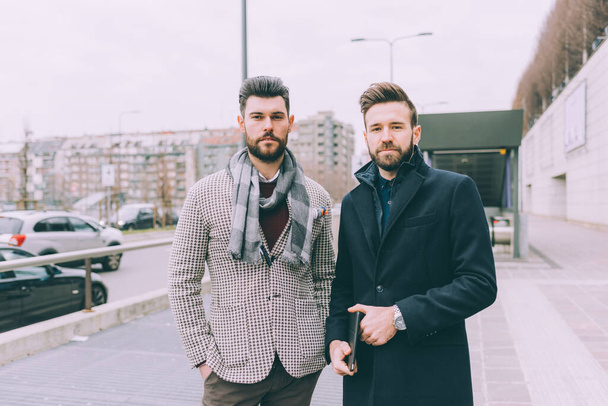 two young bearded business men outdoor posing - Foto, Imagem