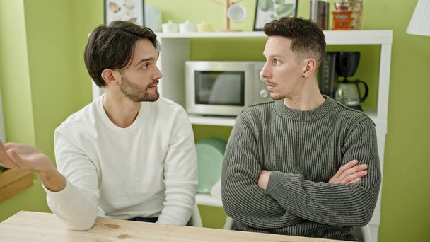 Two men couple arguing for disagreement at dinning room - Foto, Bild