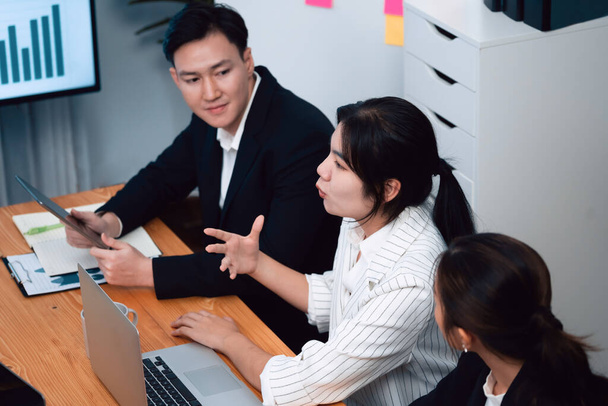 Business team of financial data analysis meeting with business intelligence, report paper and dashboard on laptop for marketing strategy. Business people working together to promote harmony in office. - Photo, image