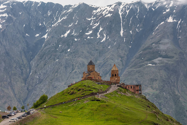 Gergeti Trinity Church near the Stepantsminda village in Georgia ,At an altitude of 2170 meters, under Mount Kazbek or Kazbegi, - Фото, зображення