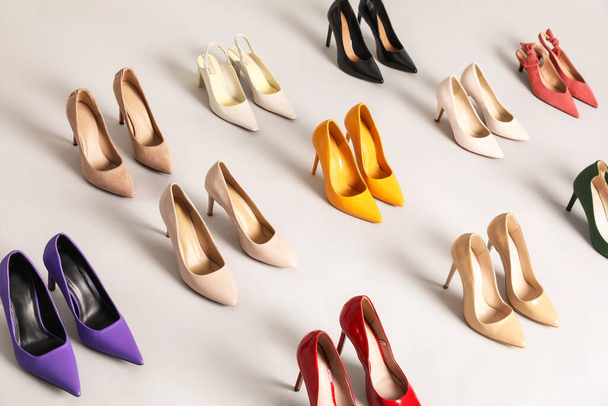 Many different stylish high heels on grey background - Photo, Image