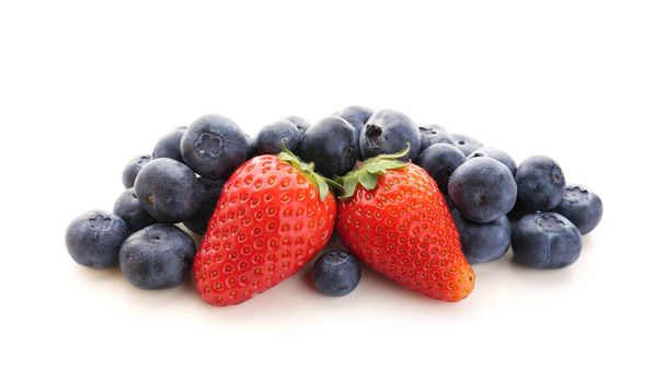 Ripe strawberry and blueberry on white background - 写真・画像