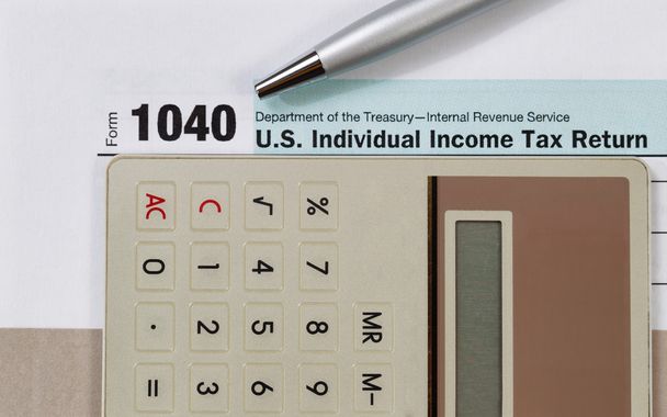 Close up of tax form with pen and calculator  - Photo, Image