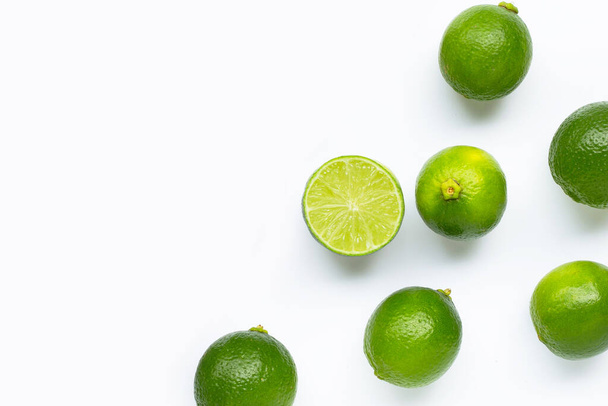 Fresh limes isolated on white background. Top view - Photo, image
