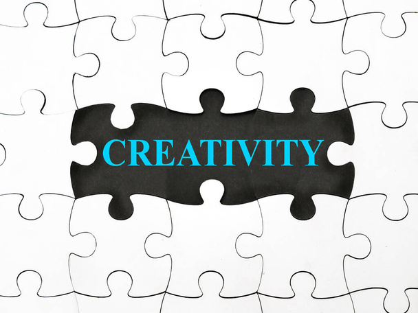 Creativity, text words typography written under jigsaw puzzle, life and business motivational inspirational terms concept - Foto, immagini