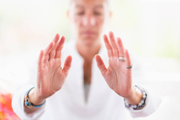 Mindful woman performing respect gesture with her hands. Spiritual awakening. - Fotografie, Obrázek