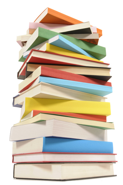 Very tall stack of colorful books - Фото, изображение