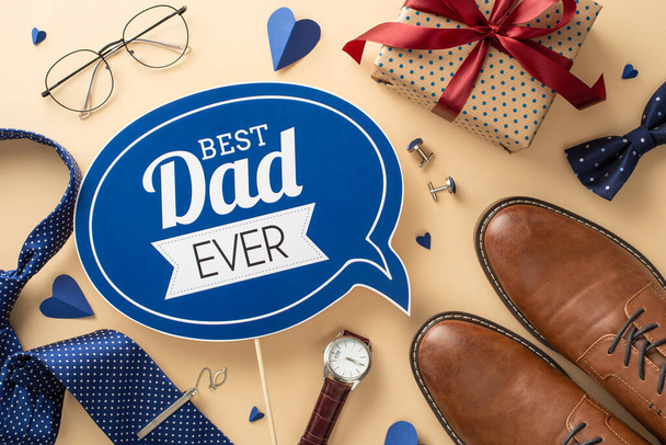 Exquisite Father's Day tribute concept. Top view shot of greeting plaque, leather shoes, hearts, necktie, cufflinks, spectacles, wristwatches, bow-tie and giftbox arranged on a neutral surface - Fotó, kép