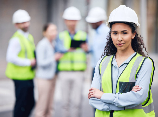Business woman, architect and arms crossed in leadership or project management for construction on site. Portrait of female person, engineer or manager in team planning for industrial architecture. - Foto, immagini