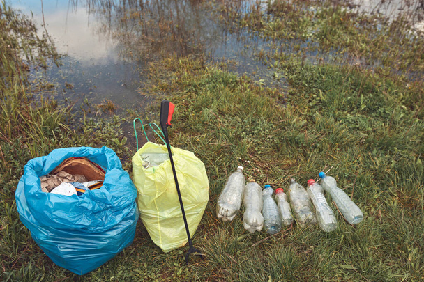 Collected trash thrown away in nature. - Valokuva, kuva