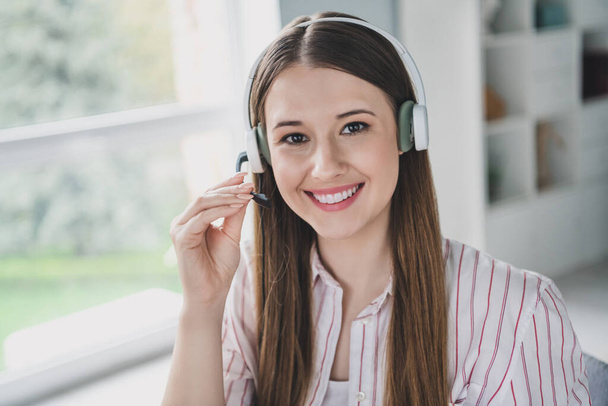 Photo portrait of pretty young girl work call center hotline dressed stylish smart casual outfit interior modern furniture loft room office. - 写真・画像