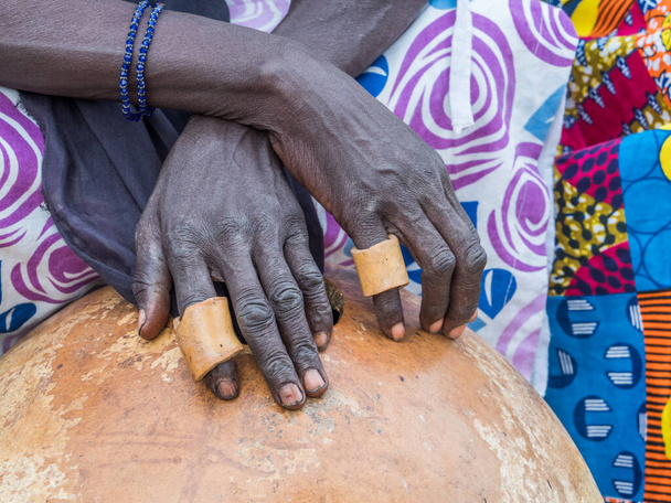 Black hands playing an African instrument. African drum. - Fotografie, Obrázek