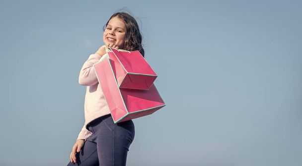 happy teen child with shopping paper bag. copy space. - Photo, Image