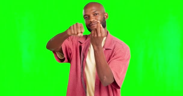 Portrait, rude and hand gesture with a black man on a green screen background saying fuck you. Angry, insult and middle finger with a young male on chromakey mockup feeling bad, unhappy or upset. - Metraje, vídeo