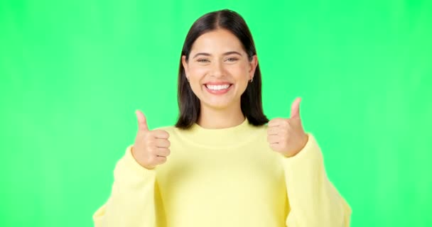 Happy woman, face and thumbs up on green screen for winning, success or agreement against a studio background. Portrait of female smile showing thumb emoji, yes sign or like on chromakey mockup. - Footage, Video