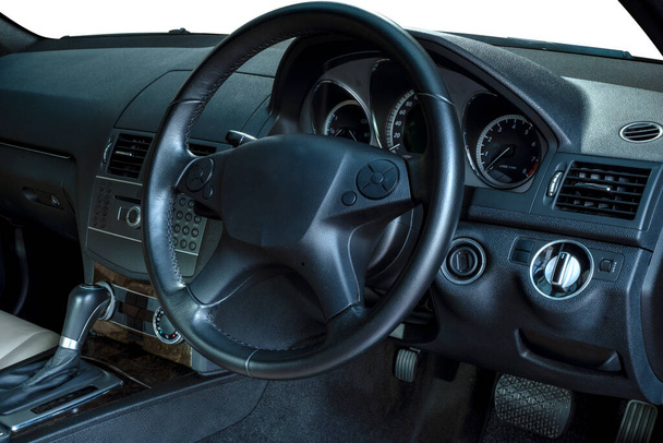 Steering wheel, shift lever, dashboard, speedometer display. Modern car interior - Φωτογραφία, εικόνα