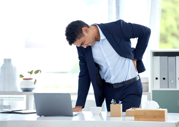 Business, stress and man with back pain, health issue and consultant with muscle tension, strain and discomfort. Male person, employee and agent with posture problems, medical injury and overworked. - 写真・画像